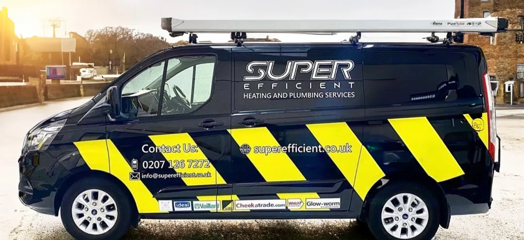 A liveried Super Efficient van with its roof rack and contact details